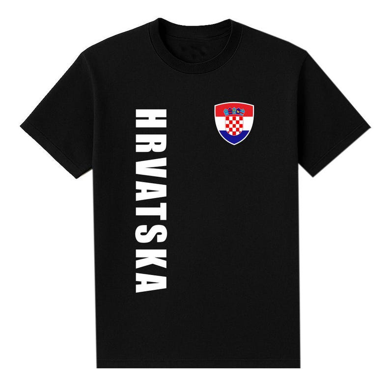 May include: Black t-shirt with the word "HRVATSKA" printed vertically in white on the left side. A Croatian coat of arms is on the right chest. The coat of arms is a shield with a red and white checkered pattern.