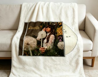 Manta Ella Langley Dandelion, macia e aconchegante, ideal para fãs de música country.