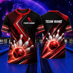 May include: Black bowling shirt with red detailing and a bowling ball and pins design. The shirt displays the text "YOUR NAME" on the front and "TEAM NAME" on the back. The sleeves are printed with the word "BOWLING".