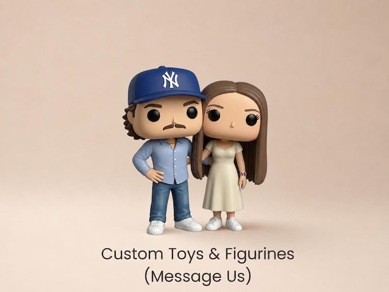 May include: Two stylised vinyl figurines standing side by side. The left figure wears a blue baseball cap with a white logo, a light blue button-down shirt, blue jeans, and white trainers. The right figure has long brown hair and wears a cream dress.