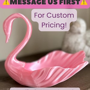 May include: A glossy pink swan-shaped dish with a curved neck and a shell-like body. The image includes text that reads: MESSAGE US FIRST For Custom Pricing! A specific discount code or price adjustment will be provided at checkout.