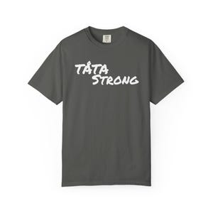 May include: Dark gray t-shirt with the white text "TATA STRONG" in a handwritten style. The shirt has short sleeves and a crew neck. The shirt is made of a soft, comfortable material.