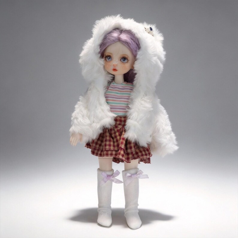 May include: A doll wearing a white faux fur hooded coat, a striped shirt, and a plaid skirt. The doll has purple hair and is wearing white boots with lavender bows. The doll is standing in front of a gray background.