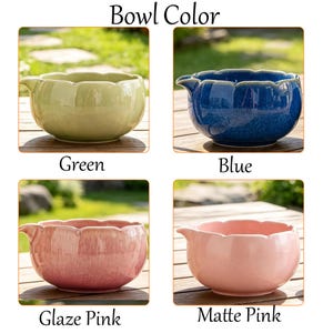 May include: A grid of four ceramic bowls with scalloped rims and pouring spouts. The colors are labeled as Green, Blue, Glaze Pink, and Matte Pink. Each bowl features a smooth, rounded body and is presented in a clear, side-by-side display format.