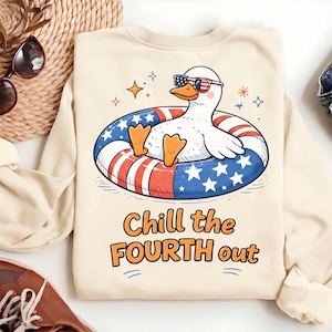 May include: A cream-colored crewneck sweatshirt featuring a graphic of a white duck wearing American flag-patterned sunglasses while floating in a patriotic inner tube. The text below reads Chill the FOURTH out in orange and black lettering.