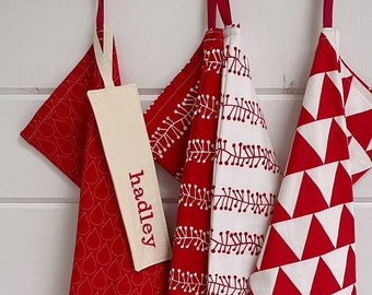 Nordic Joy Christmas Stocking: red and white holiday stocking, long skinny bright red family stocking, modern Scandinavian hearts and stars