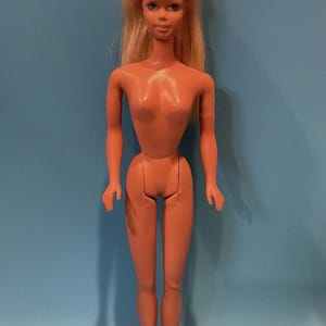 May include: A set of three ceramic mugs with a speckled, matte finish. The mugs are in shades of cream, light gray, and dark gray. Each mug has a simple, minimalist design and a rounded handle. The mugs are suitable for coffee, tea, or other beverages.