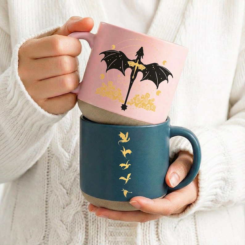 May include: A set of three ceramic mugs with a speckled, matte finish. The mugs are in shades of cream, light gray, and dark gray. Each mug has a simple, minimalist design and a rounded handle.