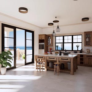 Può includere: Una cucina spaziosa con mobili in legno, un'ampia isola e elettrodomestici in acciaio inossidabile. La stanza presenta ampie porte scorrevoli in vetro che si aprono su un patio esterno con vista sull'oceano. Una pianta in vaso aggiunge un tocco di verde.