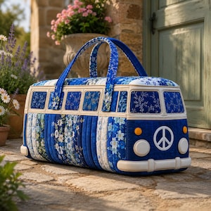May include: A blue and white quilted bag shaped like a vintage bus. The bag features floral patterns, a peace sign on the front, and a cream-colored trim. It has two blue handles and is sitting on a stone surface.