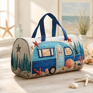 May include: A quilted, cylindrical travel bag featuring a blue and white camper design with starfish and seashell accents. The bag has a blue handle and is decorated with embroidered details, evoking a beach theme.