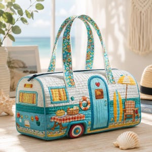 May include: A novelty duffel bag in the shape of a vintage caravan. The bag is quilted in blue and white, with floral patterned handles. It features a red heart, surfboards, and a picnic table. The bag is approximately 30 cm long.