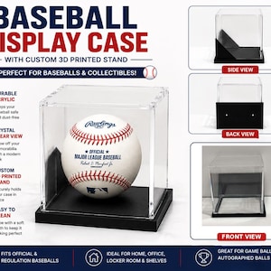 May include: A clear acrylic baseball display case featuring a black 3D printed stand. The case is shown from multiple angles, including side, back, and front views. A white baseball with red stitching and blue text is positioned inside the main display.