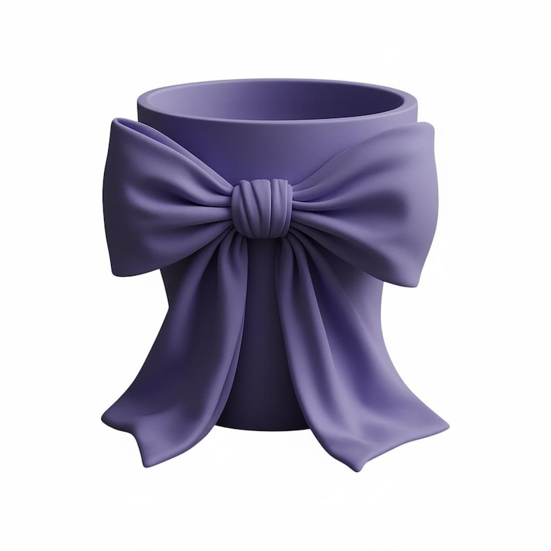 May include: A lavender-colored decorative planter with a large bow detail. The bow is centered on the front of the planter and has flowing fabric ends. The planter has a cylindrical shape and is made of a smooth material.