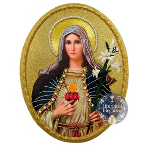 May include: An oval-shaped embroidered wall hanging featuring a figure with a golden halo, a white veil, and a dark blue mantle. The figure holds a white lily and displays a heart pierced by a sword, surrounded by roses. Text reads Liturgical Elegance.