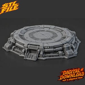 May include: A gray circular sci-fi display base featuring intricate mechanical details, vents, and a central platform. The design includes a small ramp and structural paneling. The text "STL FILE" and "DIGITAL DOWNLOAD not a physical item" appear.