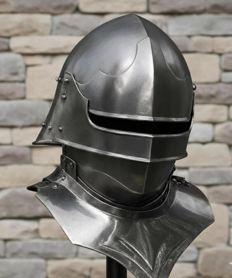 May include: A detailed, close-up view of a medieval steel helmet. The helmet features a rounded top, a visor with a horizontal slit, and a neck guard. Rivets secure the various plates. The metallic surface reflects light, highlighting its craftsmanship.