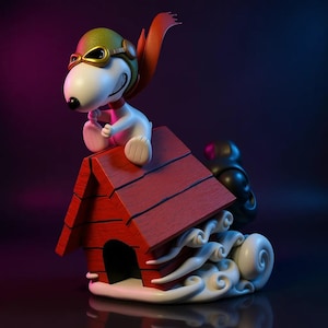 May include: A figurine of Snoopy as the Flying Ace, perched atop his red doghouse. Snoopy wears a green aviator helmet with gold goggles and a red scarf. The doghouse sits on a cloud-like base, with a dark background.