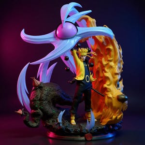 May include: A detailed figurine of a character in a yellow jacket and black trousers, with spiky yellow hair. The figure is surrounded by stylized flames and a large, light blue and purple structure. Black orbs float around the figure.