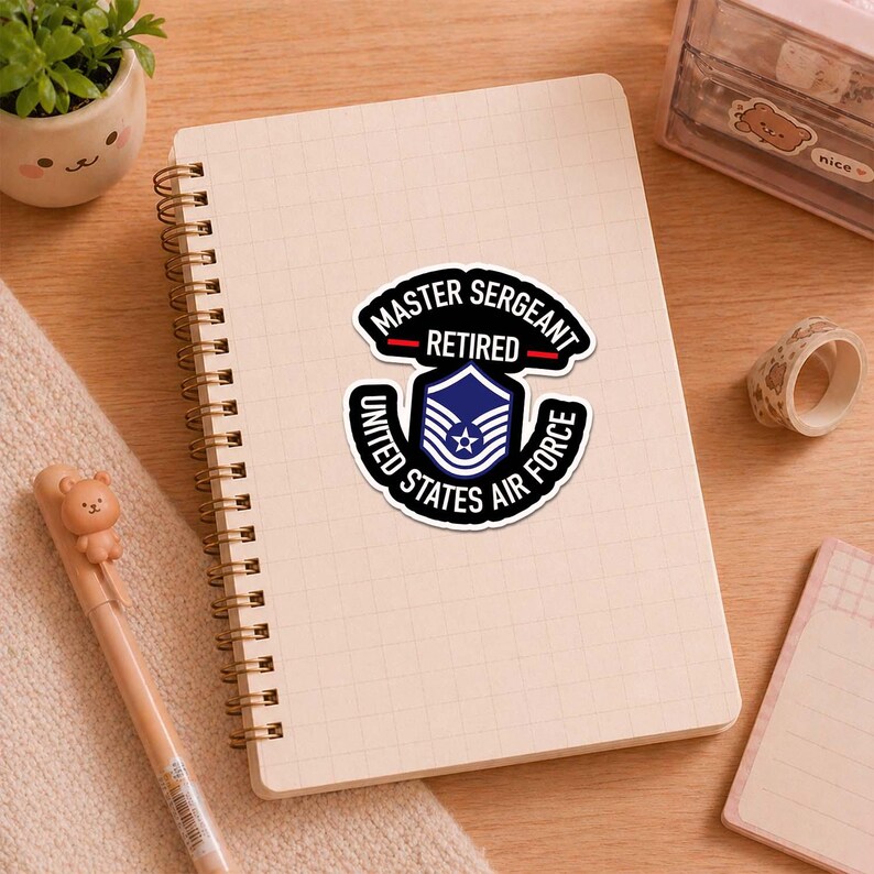May include: A sticker with the text "MASTER SERGEANT RETIRED" in a black and white design with a blue and white Air Force emblem. The sticker also includes the words "UNITED STATES AIR FORCE".