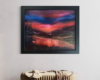 May include: A framed painting of a forest scene with a lake in the foreground. The sky is a vibrant red and orange, with a dark blue cloud in the upper left corner. The trees are silhouetted against the sunset.
