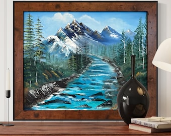 May include: A framed painting of a mountain landscape with a river flowing through it. The mountains are snow-capped and the river is a bright blue. The painting is in a rustic wooden frame.