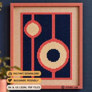 May include: A framed cross-stitch pattern featuring a dark blue background with two cream-colored circles outlined in coral pink. Vertical coral pink lines connect the circles. Text includes INSTANT DOWNLOAD, BEGINNER FRIENDLY, and A4 & US LEGAL PDF FILES.