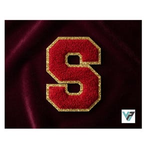 May include: A varsity-style letter S patch featuring a textured red chenille center surrounded by a shimmering gold glitter border. The letter has a bold, block-style font design with clean, sharp edges, creating a distinct and high-contrast appearance.
