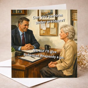 May include: Greeting card featuring a humorous illustration of a job interview. The text reads, "Can you perform under pressure?" and "No, but I'll give Bohemian Rhapsody a go."