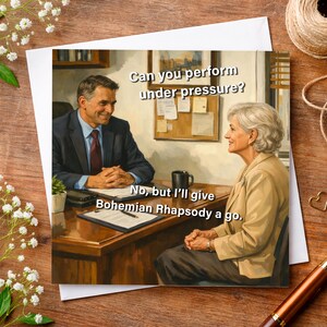 May include: Greeting card with a humorous image of a job interview. The text reads, "Can you perform under pressure?" and the response, "No, but I'll give Bohemian Rhapsody a go." The card features two people in an office setting.
