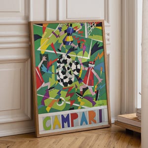 May include: A framed rectangular poster featuring a colorful, abstract soccer scene with geometric players and a soccer ball on a green field. The word CAMPARI is printed in large, multi-colored block letters at the bottom of the artwork.