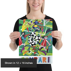 May include: A colorful art print featuring a stylized soccer scene with players, a goal, and multiple soccer balls on a green field. The design includes geometric shapes in red, blue, yellow, and black. The word CAMPARI is printed at the bottom.