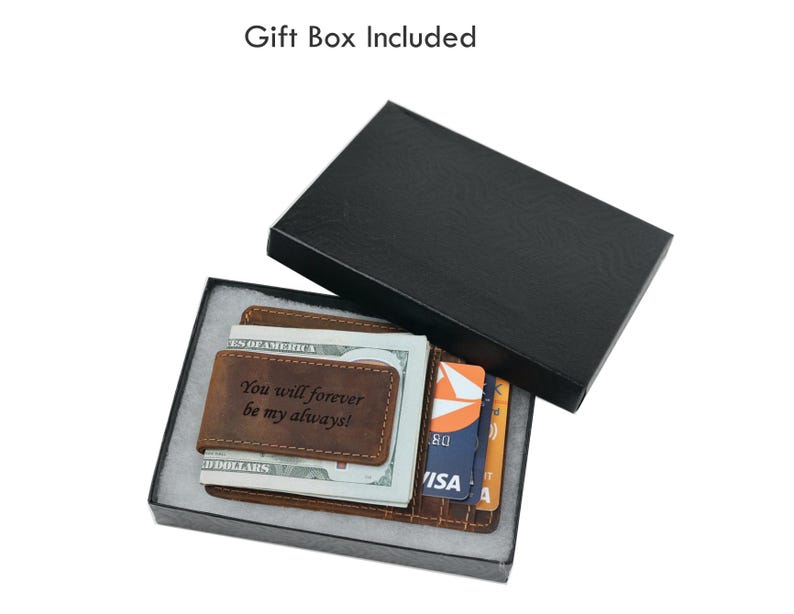 May include: A brown leather wallet with a money clip and a personalized inscription that reads "You will forever be my always!" The wallet is displayed in a black gift box.