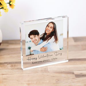 May include: A clear acrylic photo block with a picture of a couple. The text "Happy Valentine's Day Love you always - Chris" is engraved on the bottom of the block.