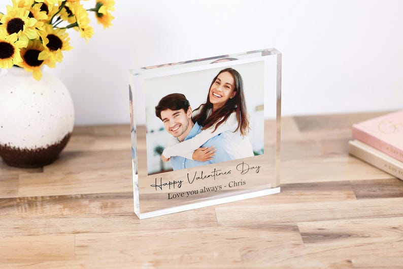 May include: A clear acrylic photo block with a picture of a couple. The text "Happy Valentine's Day Love you always - Chris" is engraved on the bottom of the block.