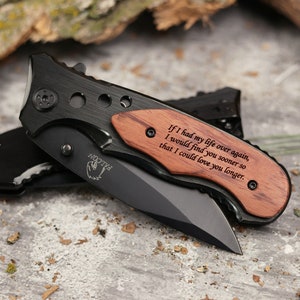 May include: A black folding knife with a wooden handle engraved with the text "If I had my life over again, I would find you sooner so that I could love you longer."