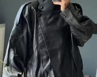 Giacca bomber in pelle nera: silhouette oversize anni '80, vera pelle, collo alto