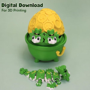 May include: A green cauldron with two leprechaun-like figures wearing green hats, topped with a yellow dome of coins. The words "Digital Download For 3D Printing" are at the top. Several green and white clover-shaped pieces are at the bottom.