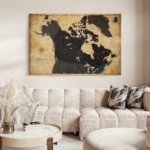 May include: A rectangular wall map featuring a dark brown landmass of North America set against a light tan, vintage-style parchment background. The map includes a compass rose in the lower left corner and the text My world printed in black.
