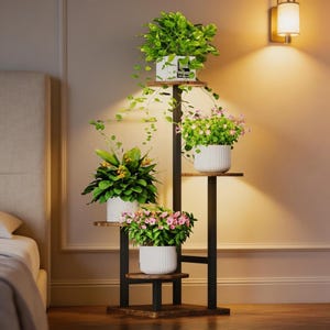 May include: A multi-tiered plant stand with four levels, holding various potted plants with green foliage and pink flowers. The stand has a black metal frame and wooden shelves, creating a decorative display. The stand is 50 inches tall.