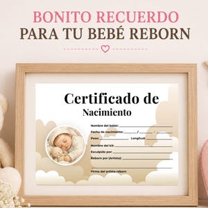 May include: A rectangular wooden frame containing a white birth certificate for a reborn doll. The document features the text Certificado de Nacimiento, a circular photo of a sleeping infant, and blank lines for name, date, weight, and length.