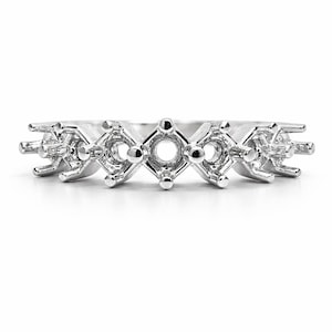 May include: A silver ring setting with multiple square and round openings for stones. The ring features a repeating pattern of square settings with prongs, alternating with round settings. Designed to hold multiple gemstones.