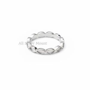 May include: A silver ring with a repeating oval design. The ring is set against a white background. The text "All Silver Mount" is visible in the image.