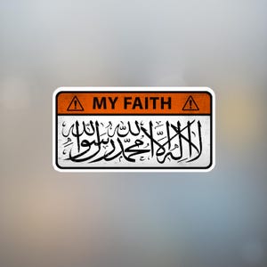 May include: A rectangular sticker featuring an orange top section with the white text "MY FAITH". Below, there is detailed black calligraphy on a white background. The sticker has a black border and a warning symbol.