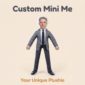 May include: A custom plushie doll featuring a printed image of a person with gray hair wearing a gray suit, white shirt, and black tie. The text Custom Mini Me is printed above the doll, and the text Your Unique Plushie is printed below.