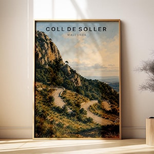 May include: Framed print of Coll de Soller, Mallorca, featuring a winding road through a mountainous landscape. The artwork has a vintage aesthetic with a warm color palette of greens, browns, and blues. The text "COLL DE SOLLER MALLORCA" is at the top.