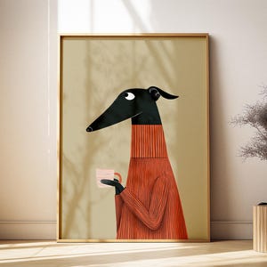 May include: A framed art print depicting a dog-like character with a black head and a red sweater, holding a pink and white cup. The background is a light tan colour. The print is in a wooden frame.