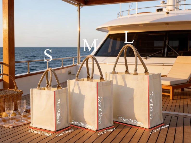 May include: Three canvas tote bags in varying sizes, labeled S, M, and L. The bags have beige fabric, red trim, and jute handles. Measurements are provided in inches: S is 8.27" x 5.91" x 9.06", M is 10.24" x 5.91" x 10.24", and L is 14.76" x 6.10" x 10.63".