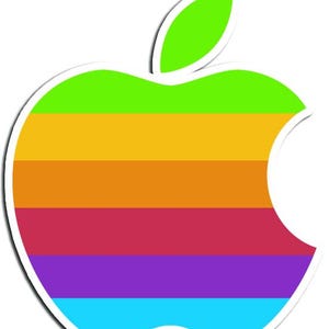May include: A colorful apple logo sticker with a white border. The apple is divided into horizontal stripes of green, yellow, orange, red, purple, and blue. A green leaf is at the top. The design is a retro style.