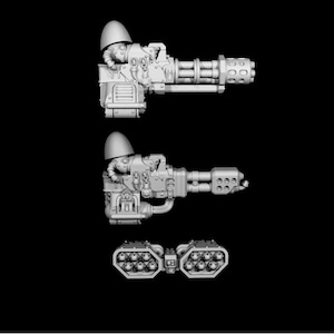 May include: A detailed, grey miniature weapon set, featuring a multi-barrelled gun and a smaller, multi-chambered component. The design includes intricate mechanical details, suggesting a futuristic or sci-fi theme. The components are displayed against a black background.